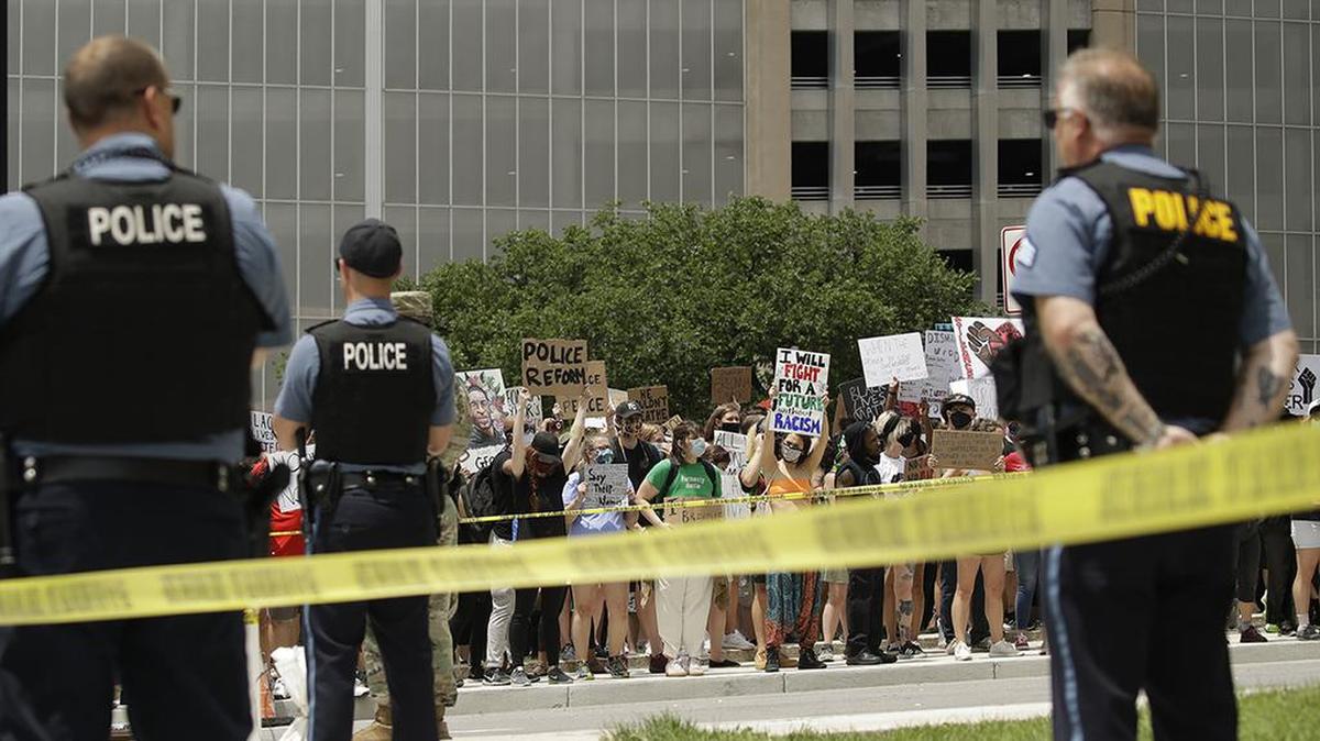 Demonstrators gather at police headquarters in downtown Kansas City on June 5.