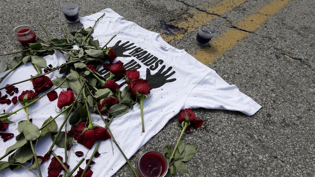 
A year after the police killing of Michael Brown, the story of Ferguson, Mo., remains in flux. This photo from 10 days after the Aug. 9, 2014, shooting shows a memorial on the spot where Brown was killed. 
