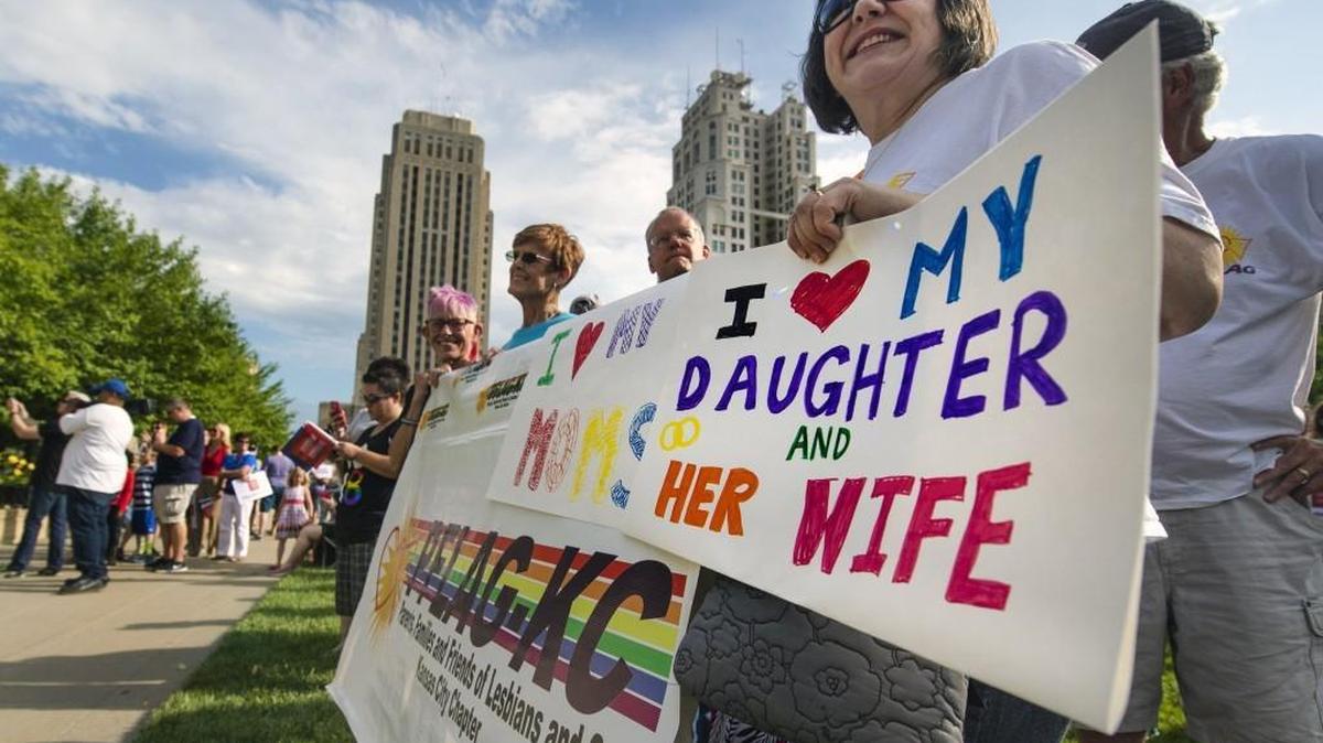 Carolyn Finken-Dove held a sign last summer in Ilus E. Davis Park downtown as she celebrated with other members of the Kansas City chapter of Parents, Families and Friends of Lesbians and Gays. The U.S. Supreme Court in June voted 5-4 to legalize same-sex marriage in all 50 states.