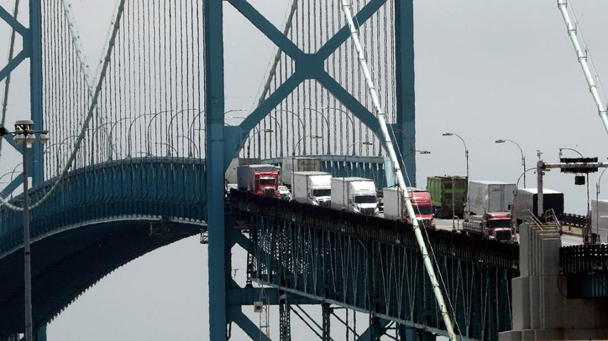 Trucks cross the Ambassador Bridge from Windsor, Ontario into Detroit.