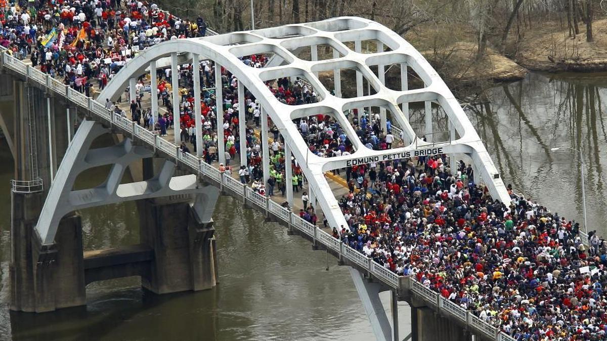 A crowd moved in a symbolic walk across the Edmund Pettus Bridge last year in Selma, Ala., marking the 50th anniversary of Bloody Sunday, a civil rights march in which protesters were beaten, trampled and tear-gassed by police. Hyman Brand Hebrew Academy and University Academy students last month marched across the bridge during their tour of the South.