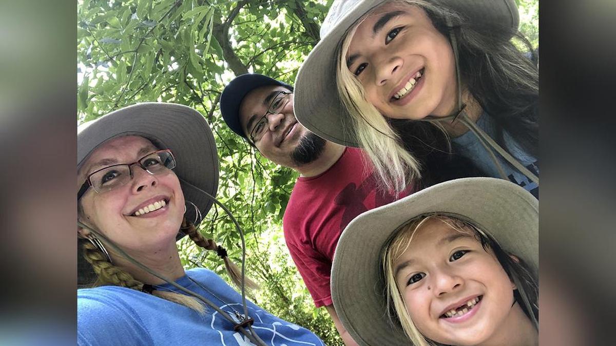 Neil Nakahodo, center, with his wife Kim Nakahodo, and their sons Ryker, 8, and Niko, 12.
