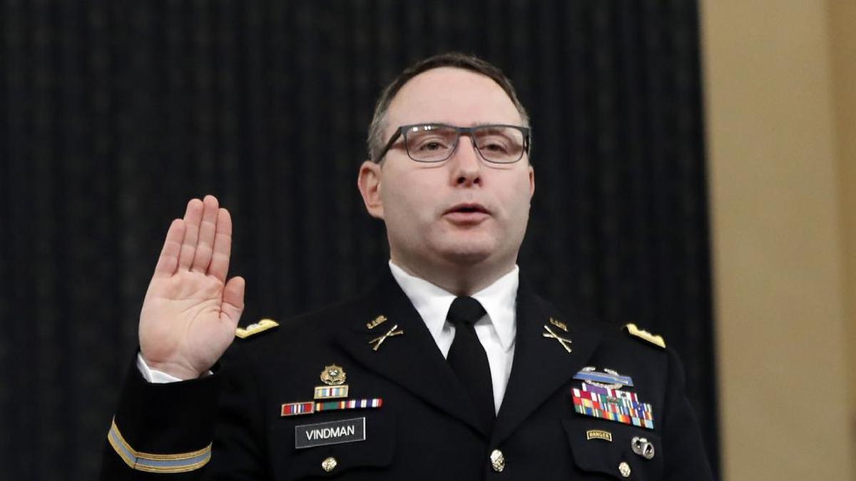 Jennifer Williams, an aide to Vice President Mike Pence, left, and National Security Council aide Lt. Col. Alexander Vindman, are sworn in to testify before the House Intelligence Committee on Capitol Hill in Washington, Tuesday, Nov. 19, 2019, during a public impeachment hearing of President Donald Trump’s efforts to tie U.S. aid for Ukraine to investigations of his political opponents. (AP Photo/Andrew Harnik)