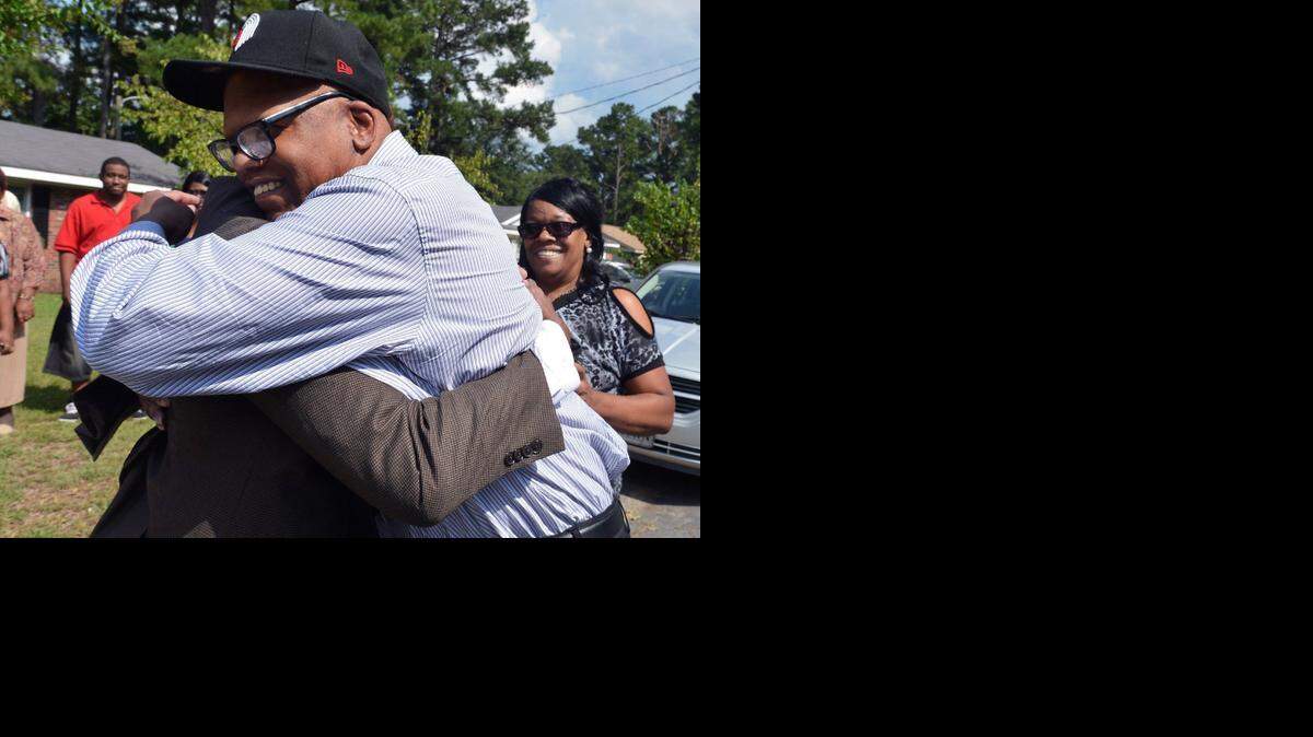 
Geraldine Brown fought back tears as her brothers Leon Brown (right) and Henry McCollum greeted each other in the front yard of her Fayetteville, N.C. home on Sept. 3. The brothers, who spent 30 years in prison for a crime they didn’t commit, were released from prison after their rape and murder conviction was dismissed by a Robeson County Superior Court judge.
