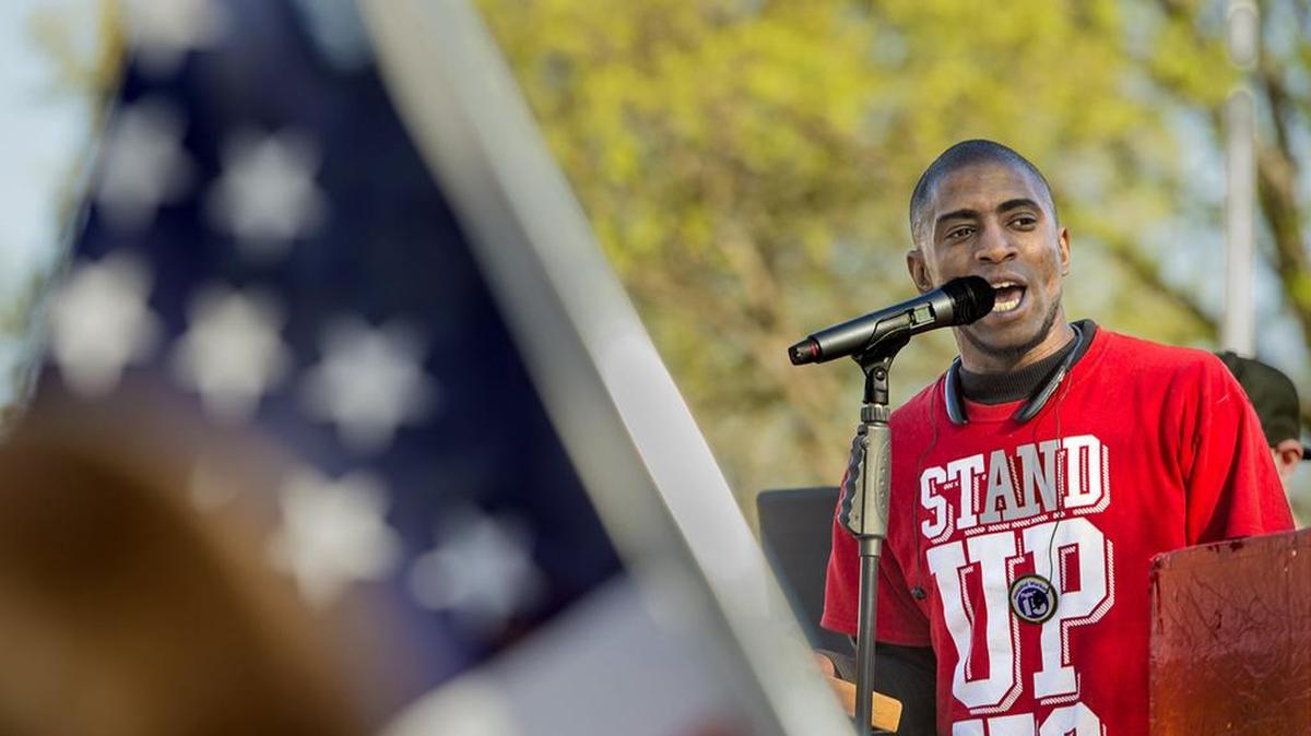 Terrence Wise spoke about increasing the minimum wage at a 2016 rally and protest march at 63rd Street and The Paseo.