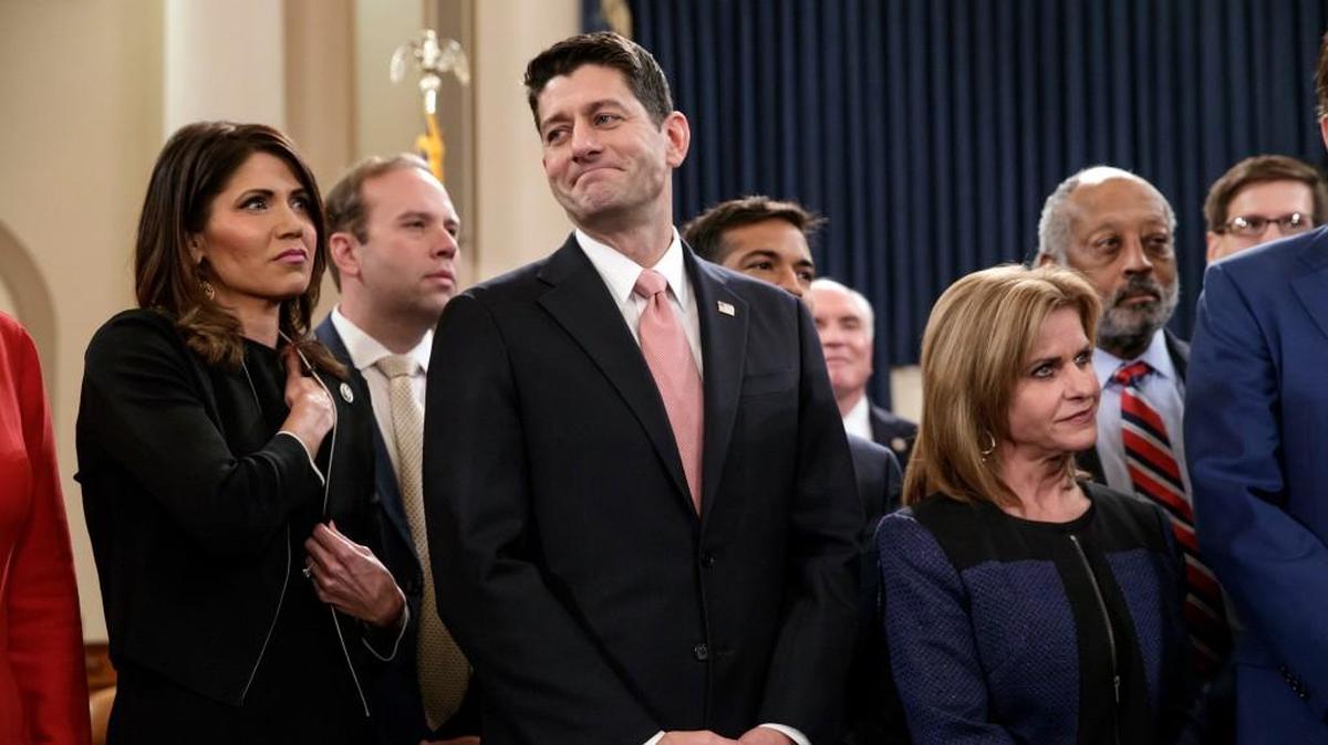 Speaker of the House Paul Ryan, flanked by Rep. Kristi Noem, left, and Rep. Lynn Jenkins, smiles as Republicans unveil their far-reaching tax overhaul on Nov. 2.