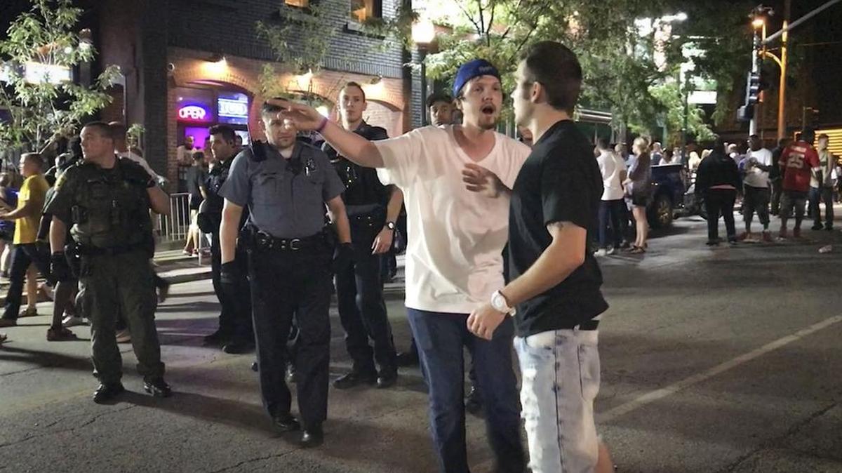 A fight began to break out and young man asks another young man to leave the bar district as Kansas City police officers and Jackson County Sheriffs deputies approached during what Kansas City police described as a typical Saturday night in Westport on July 30.