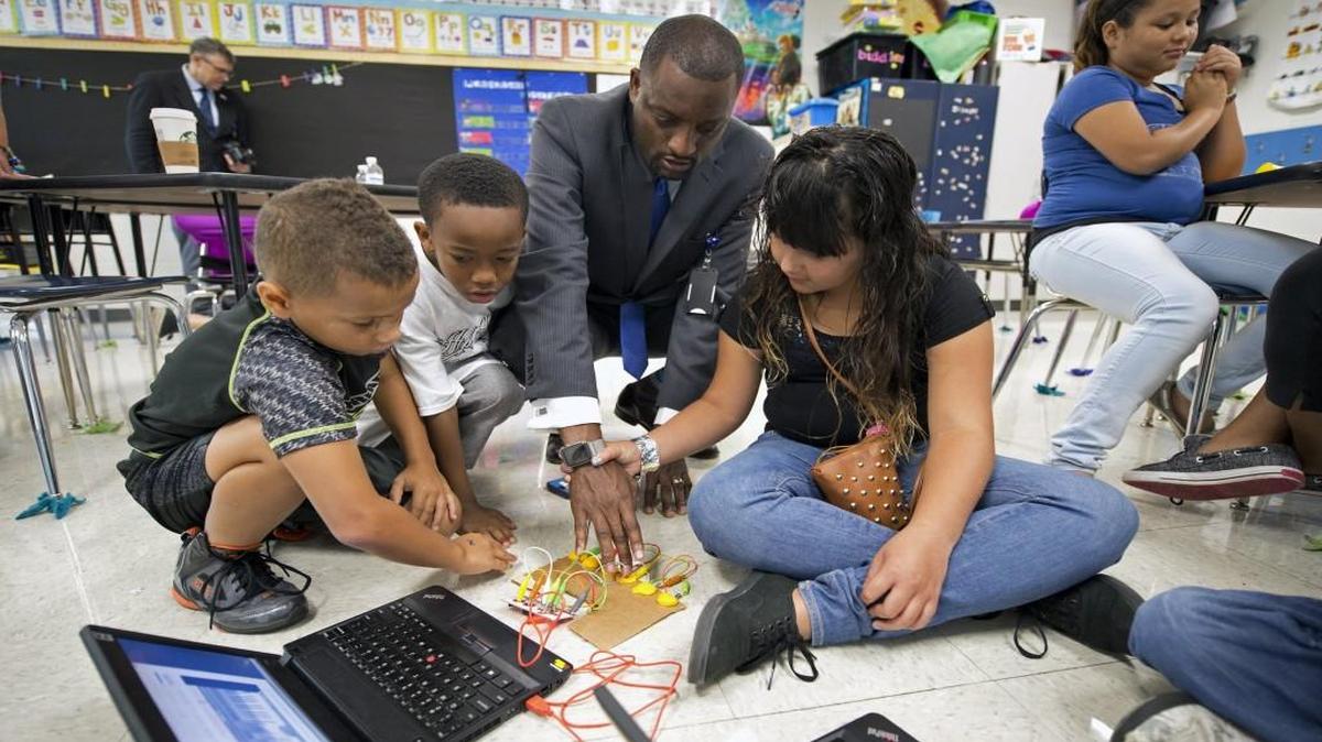 Offering young students activities that allow them to solve real-world problems gets them excited about subjects like science, technology, engineering and math. During a summer school program in Kansas City, students Kevin Torres (from left), Malachi Jones and Maria Cuevas showed Superintendent Mark Bedell a Makey Makey Invention Kit circuit board.