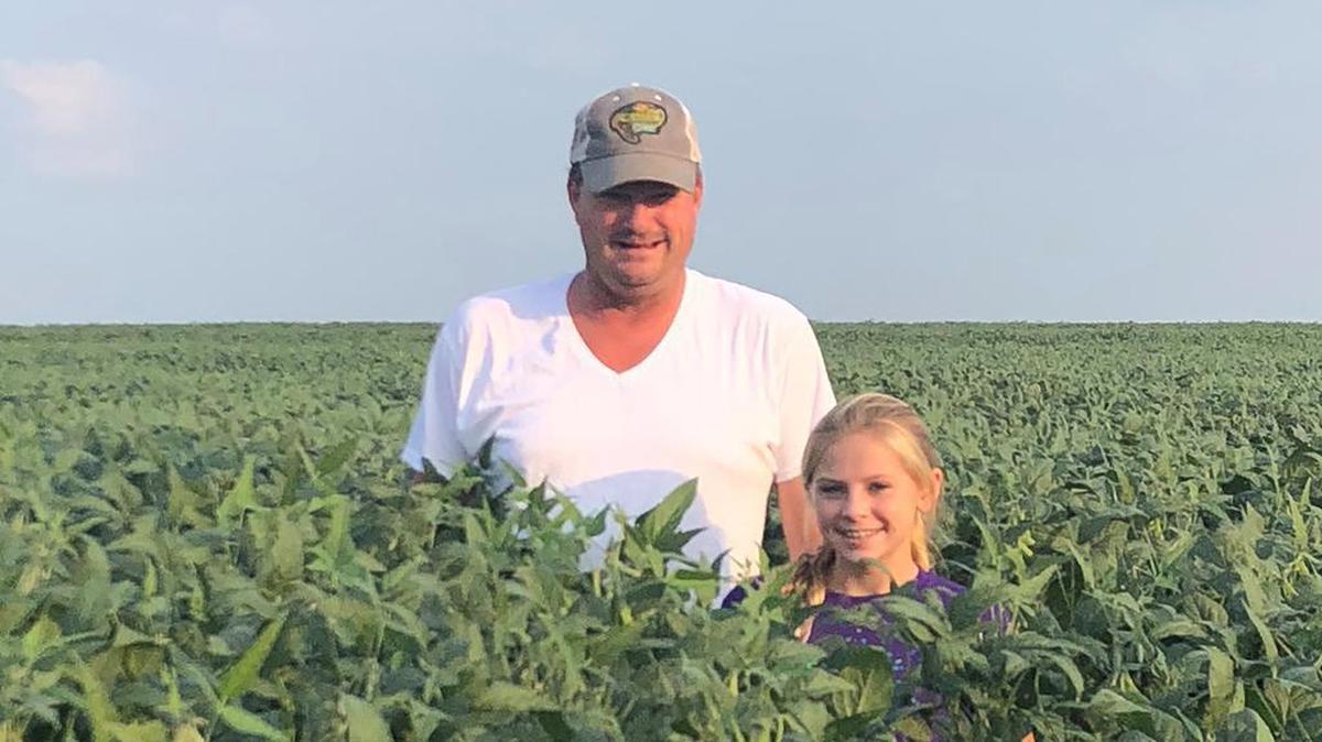 Kansas farmer Michael Spencer with his daughter, Madeline.