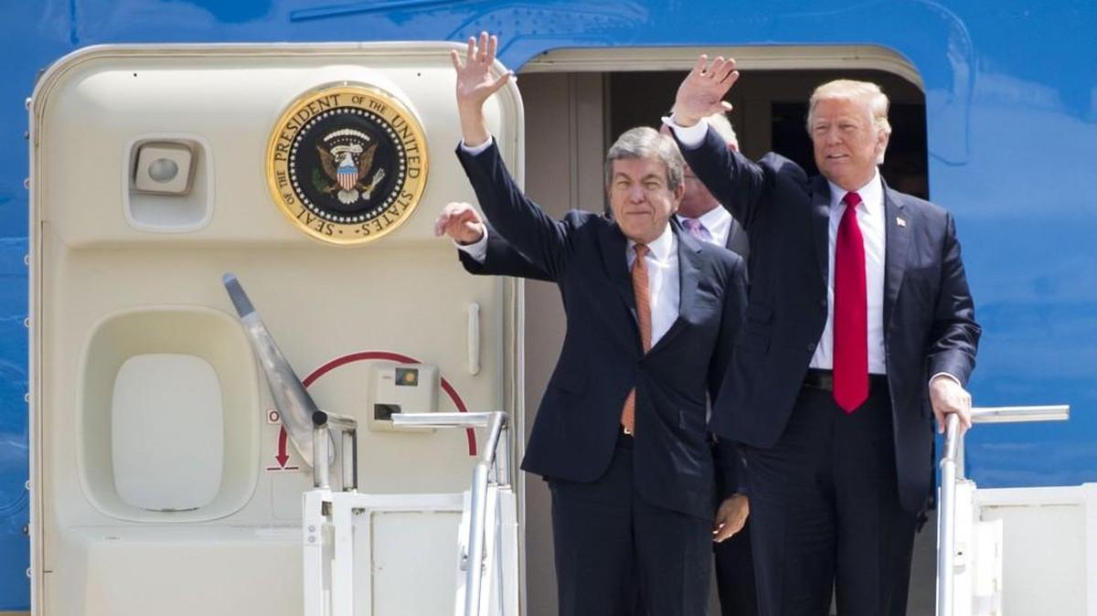 Sen. Roy Blunt (left) and President Donald Trump wave to the crowd as the arrive at Springfield-Branson National Airport on Wednesday, August 30, 2017.