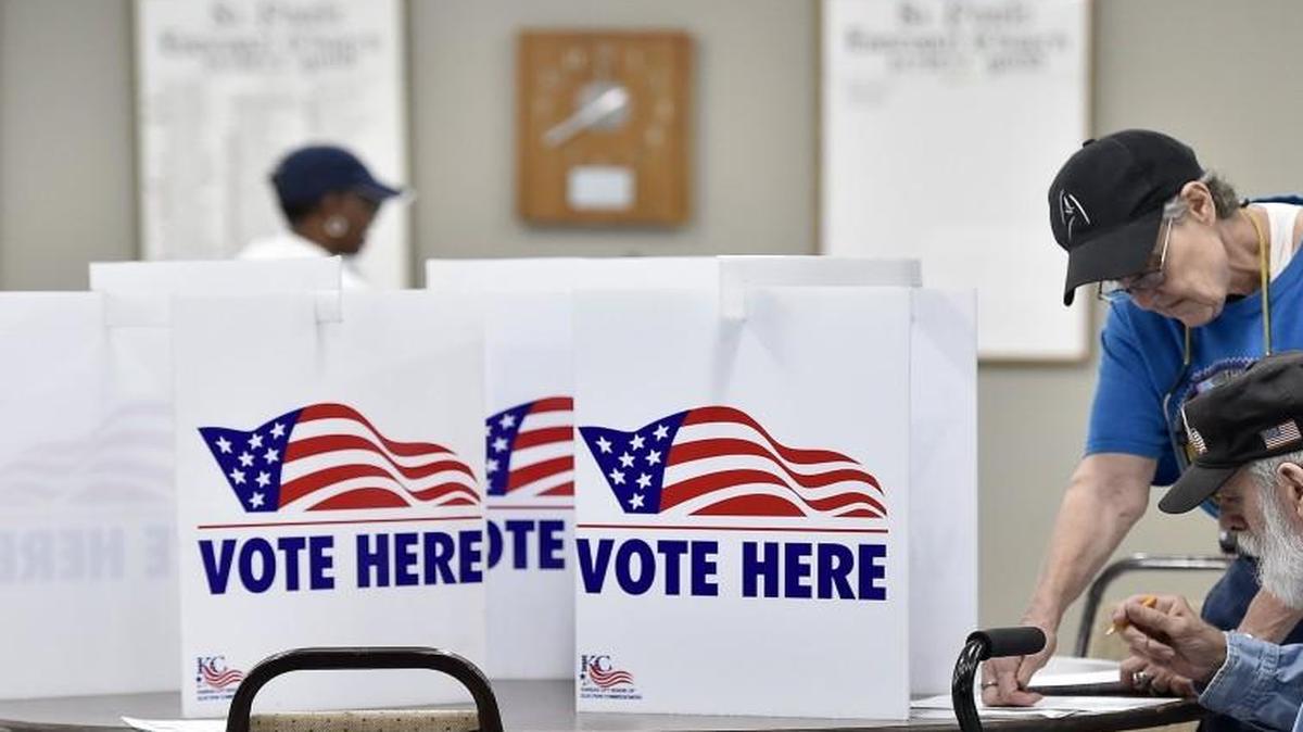 After filling out her ballot, Carol Sherman helps her husband Andy Sherman hold the ballot steady as he votes at St. Paul's Episcopal Church in the August primary. Amendment 6 to the Missouri Constitution would require people wanting to vote present a valid ID. That would negatively affect a lot of people age 50 and older.