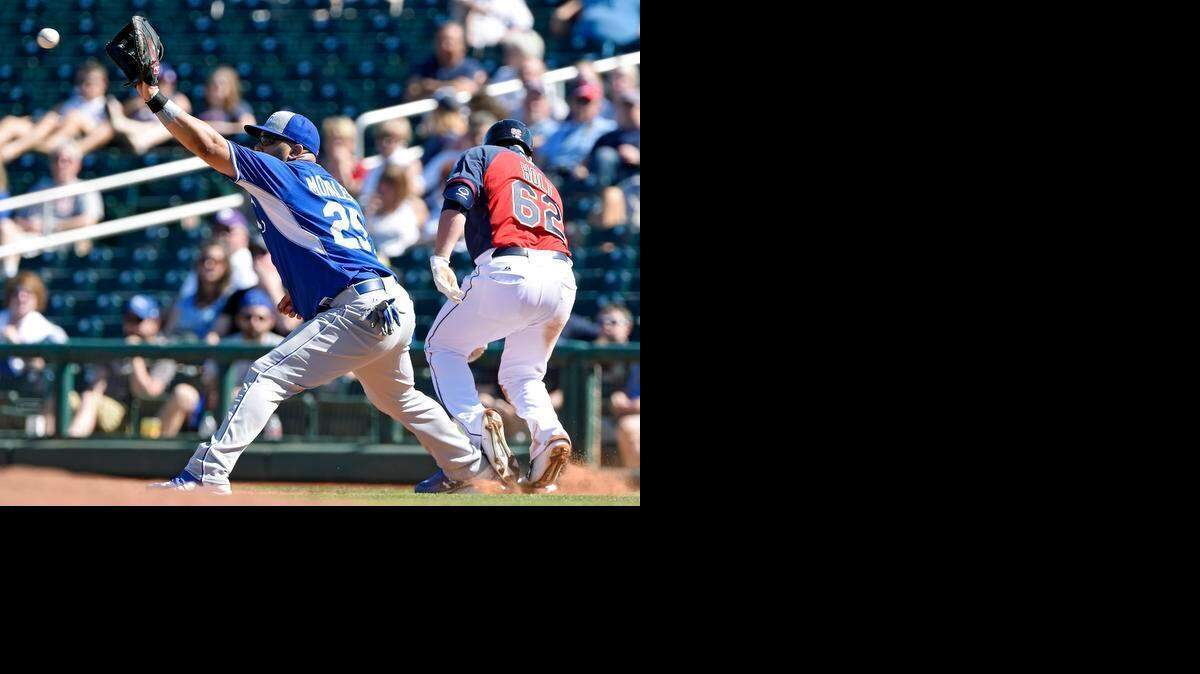 
The Cleveland Indians' Tyler Holt reached first ahead of the throw to Royals first baseman Kendrys Morales during Friday's spring-training game in Goodyear, Ariz.
