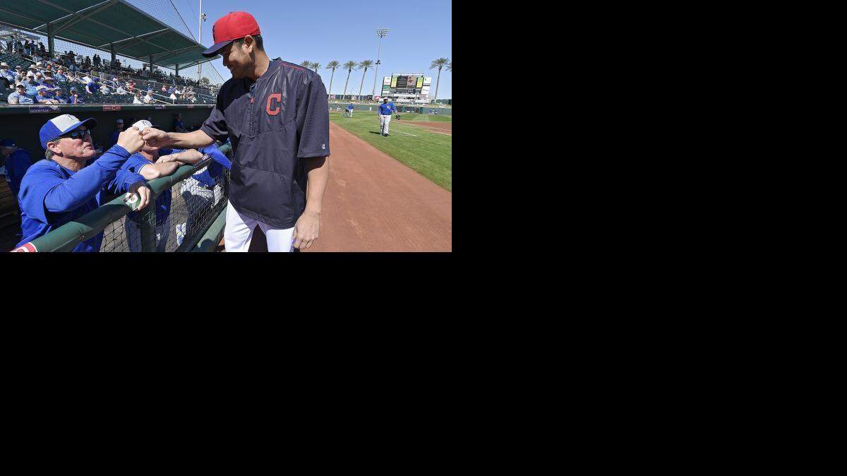 
Former Royal Bruce Chen gives a fist pump to Royals manager Ned Yost last month before a spring training game in Goodyear, Ariz.
