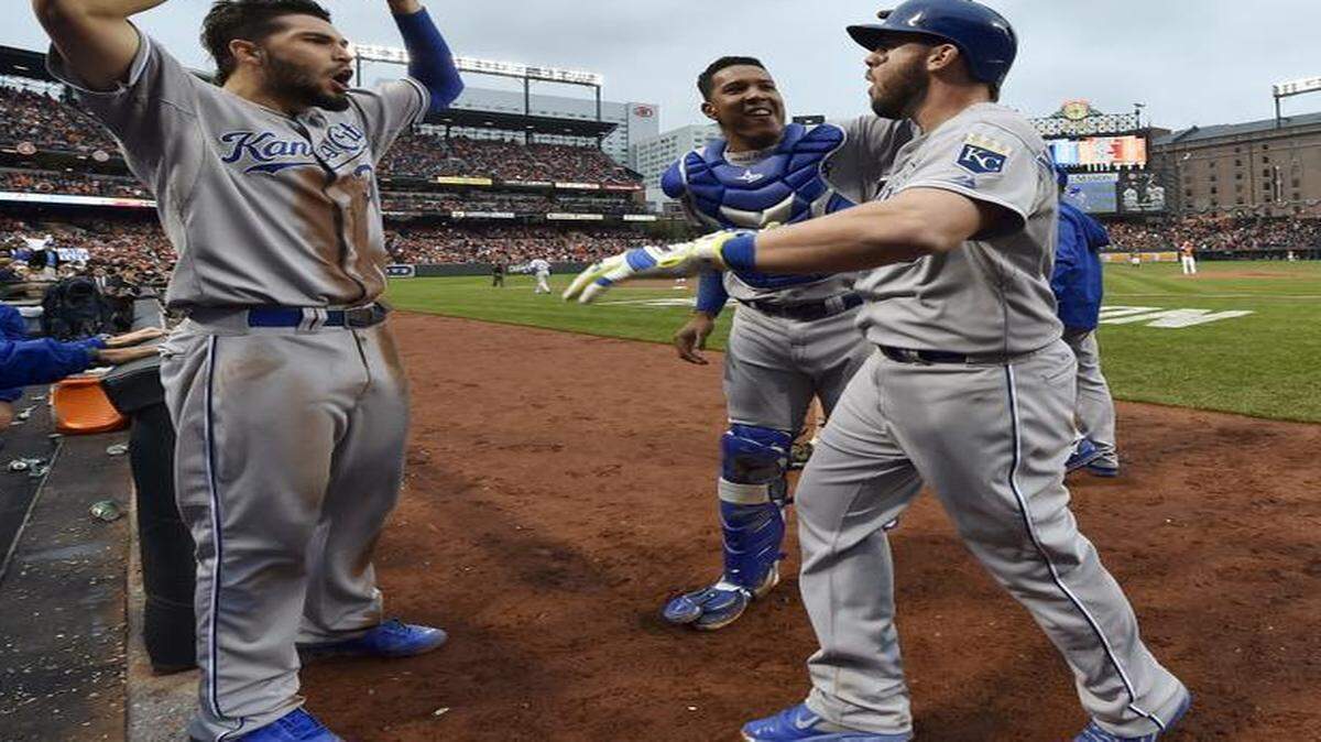 
Mike Moustakas (right) celebrated with teammate Salvador Perez center) and Eric Hosmer (left) after Moustakas hit a solo home run during the fourth inning against the Baltimore Orioles on Oct. 11, 2014, at Camden Yards in Baltimore, Md.
