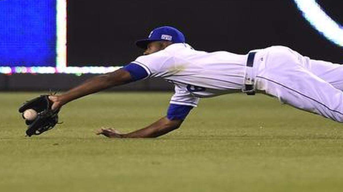 
Kansas City Royals center fielder Lorenzo Cain made a diving catch in the fifth inning, putting out Los Angeles Angels first baseman Albert Pujols in Sunday’s ALDS game on October 5, 2014, at Kauffman Stadium in Kansas City, MO.
