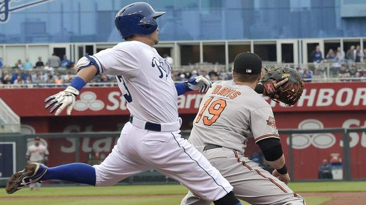 
The Royals’ Norichika Aoki beat out the throw to Baltimore Orioles first baseman Chris Davis on a grounder in the first inning on May 17, 2014, at Kauffman Stadium in Kansas City, Mo. The Royals won 1-0.
