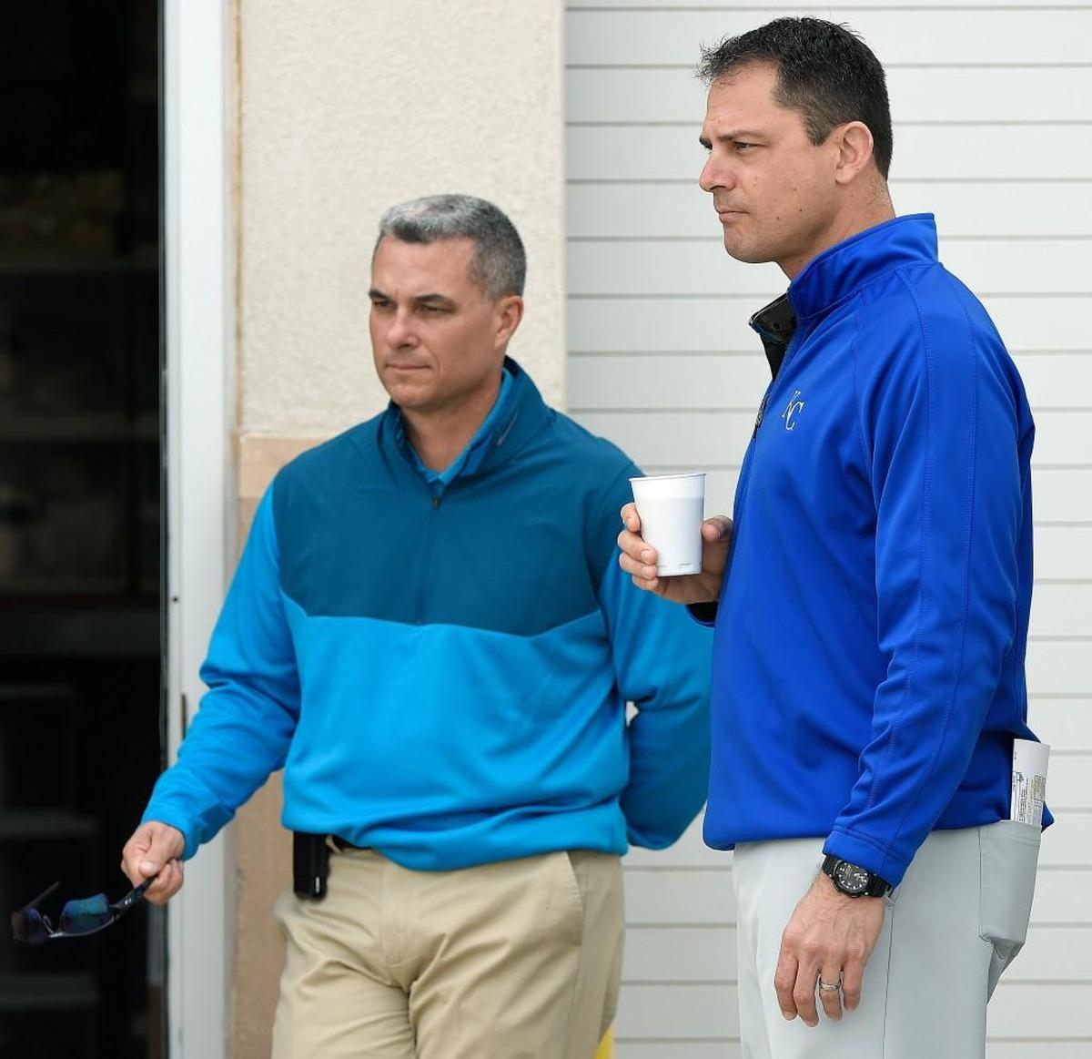 Kansas City Royals general manager Dayton Moore (left) and assistant general manager J.J. Picollo during spring training in February 2015 in Surprise, Ariz.