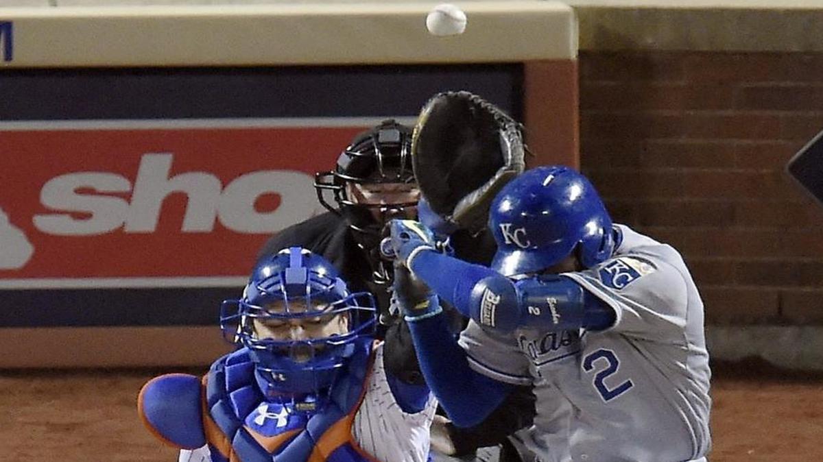 Kansas City Royals shortstop Alcides Escobar ducked to miss the first pitch by New York Mets starting pitcher Noah Syndergaard in the first inning of Game 3 of the World Series.