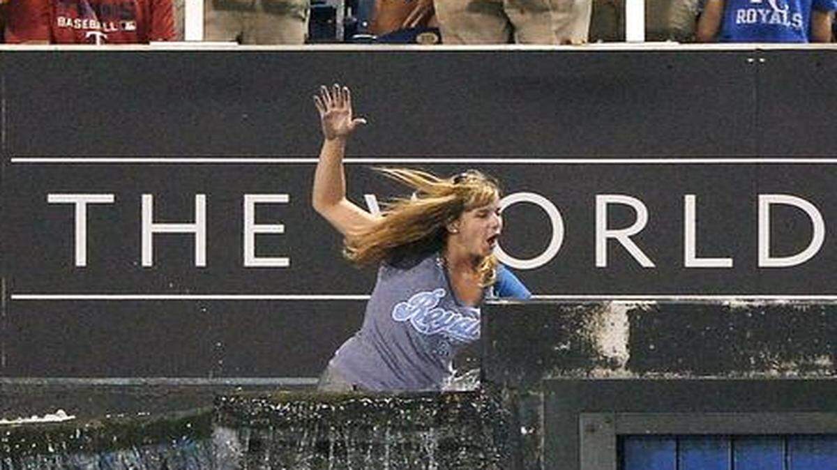 
Jessica McCoy fell into the outfield fountains after jumping the fence and walking across them during the Royals’ game against the Minnesota Twins on Aug. 5, 2013, at Kauffman Stadium.
