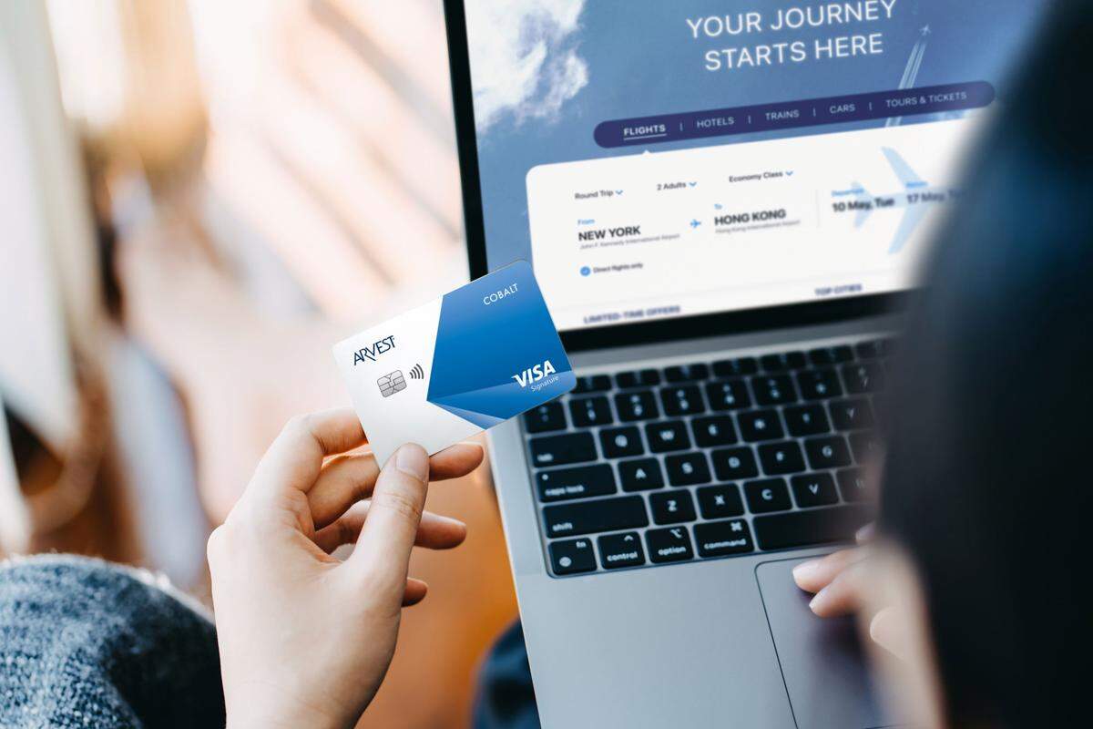 Arvest Credit Card near laptop