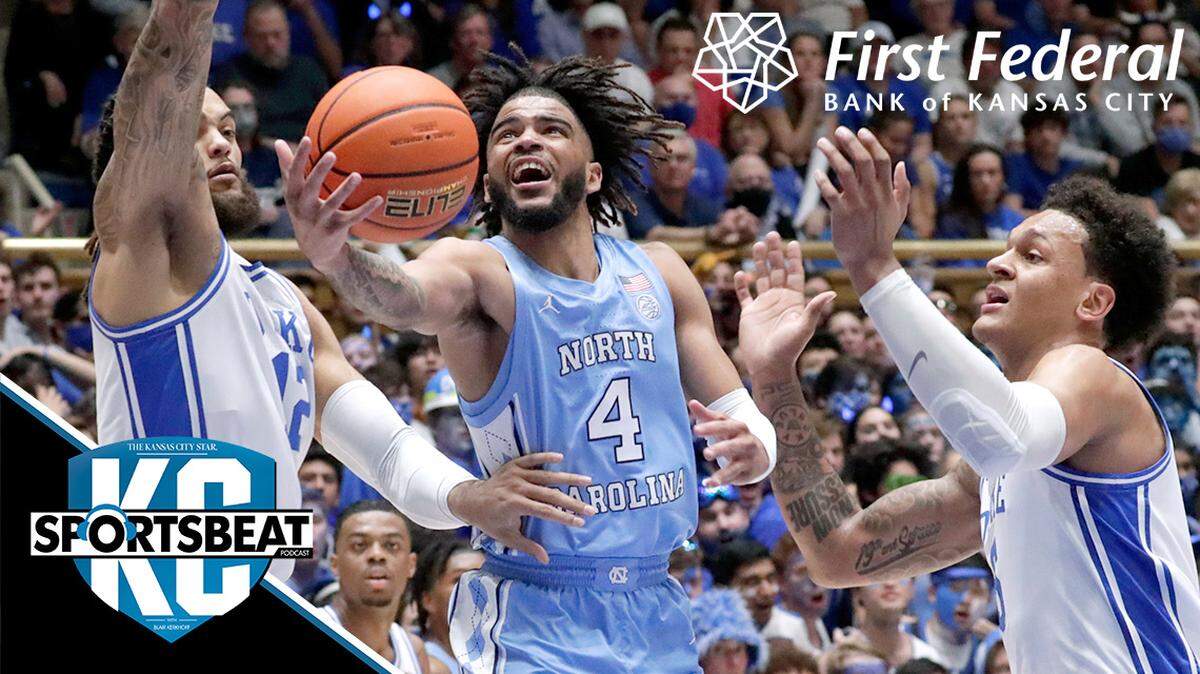 North Carolina guard R.J. Davis (4) drives between Duke forwards Theo John, left, and Paolo Banchero, right, during the first half of an NCAA college basketball game Saturday, March 5, 2022, in Durham, N.C. (AP Photo/Chris Seward)