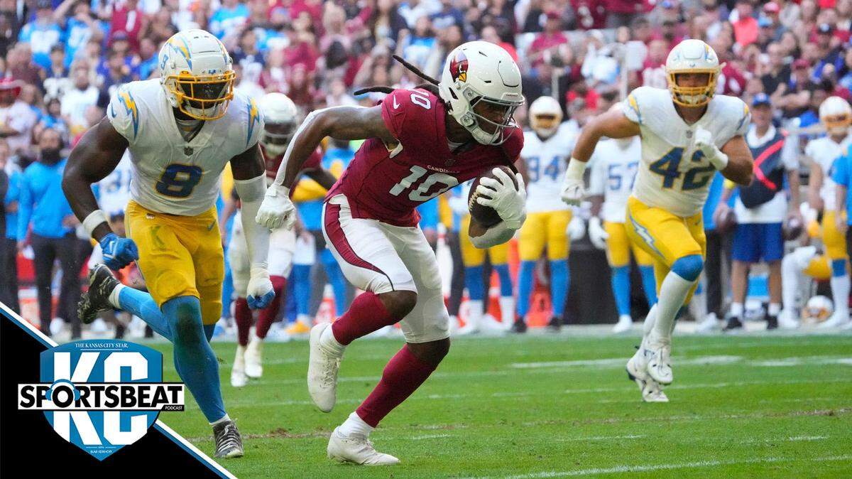 Arizona Cardinals wide receiver DeAndre Hopkins (10) runs away from Los Angeles Chargers linebackers Kenneth Murray Jr. (9) and Troy Reeder (42) before scoring a touchdown after a catch during the first quarter at State Farm Stadium in Glendale on Nov. 27, 2022.