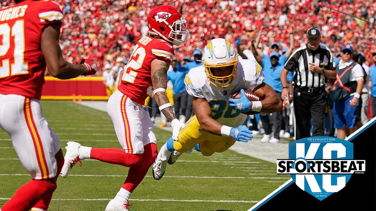 Los Angeles Chargers’ Austin Ekeler (30) dives in for a touchdown past Kansas City Chiefs’ Tyrann Mathieu (32) and Mike Hughes (21) during the first half of an NFL football game, Sunday, Sept. 26, 2021, in Kansas City, Mo. (AP Photo/Charlie Riedel)