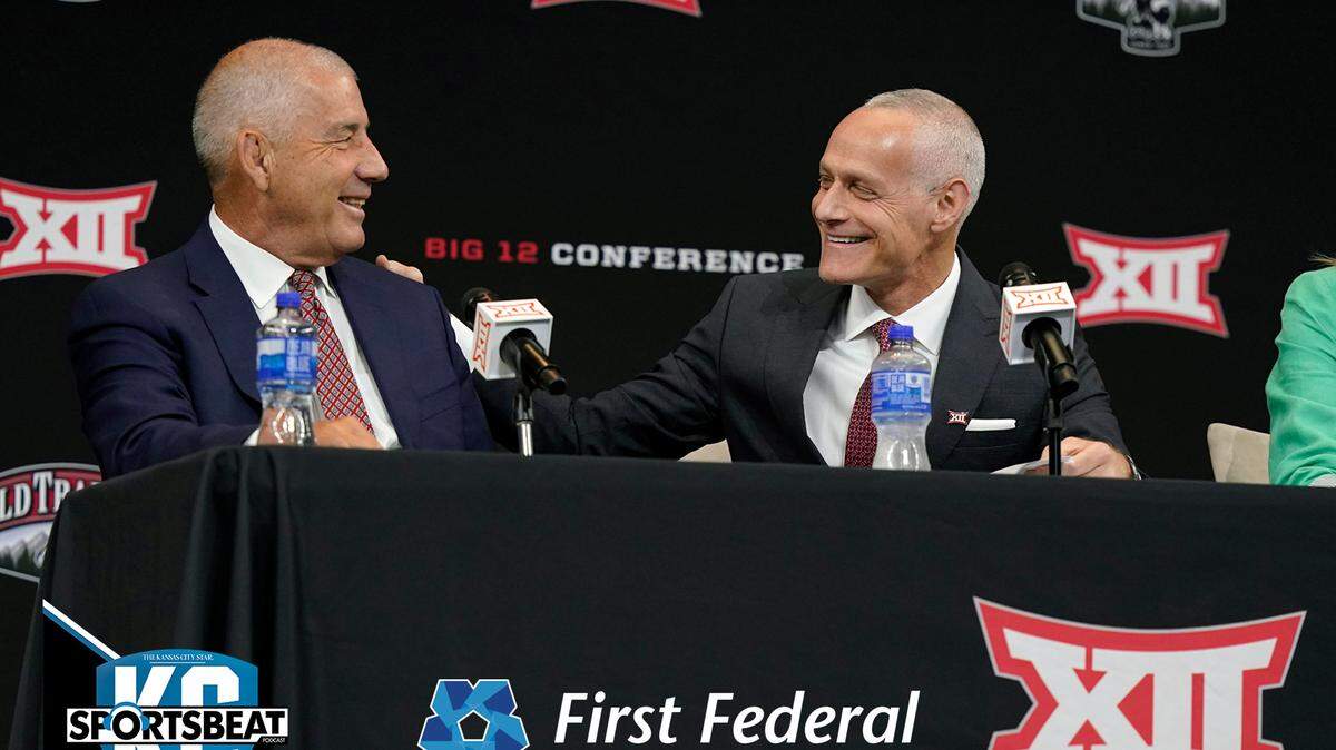 CORRECTS SPELLING OF LAST NAME TO YORMARK, NOT YORKMAN AS ORIGINALLY SENT - Incoming Big 12 Commissioner Brett Yormark, right, shares a laugh with outgoing Commissioner Bob Bowlsby at a news conference opening the NCAA college football Big 12 media days in Arlington, Texas, Wednesday, July 13, 2022. (AP Photo/LM Otero)