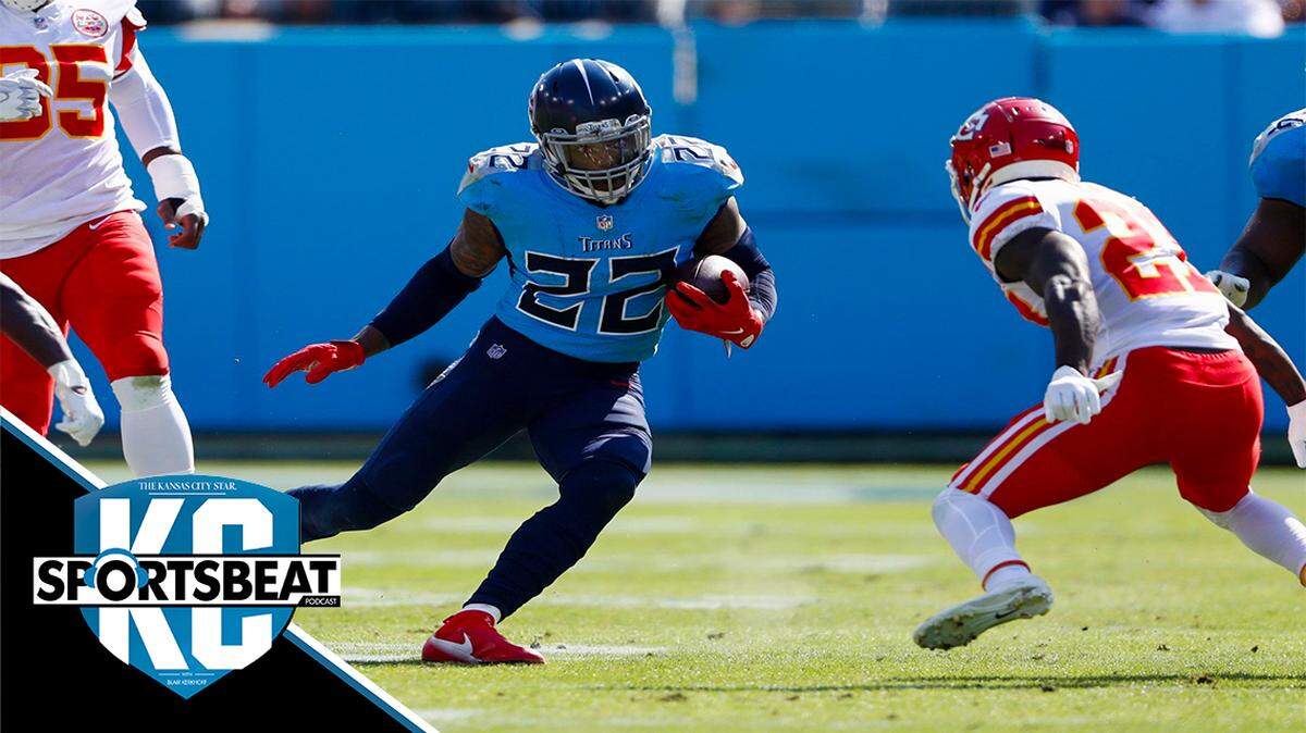Tennessee Titans running back Derrick Henry (22) carries the ball as Kansas City Chiefs defensive back Rashad Fenton, right, blocks his path in the first half of an NFL football game Sunday, Oct. 24, 2021, in Nashville, Tenn. (AP Photo/Wade Payne)