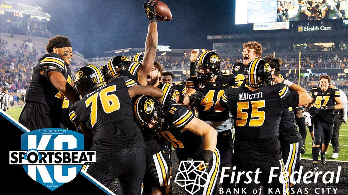 The Missouri football team swarms Missouri tight end Daniel Parker Jr. after he scored on a two-point conversion to defeat Florida during overtime of an NCAA college football game Saturday, Nov. 20, 2021, in Columbia, Mo. (AP Photo/L.G. Patterson)