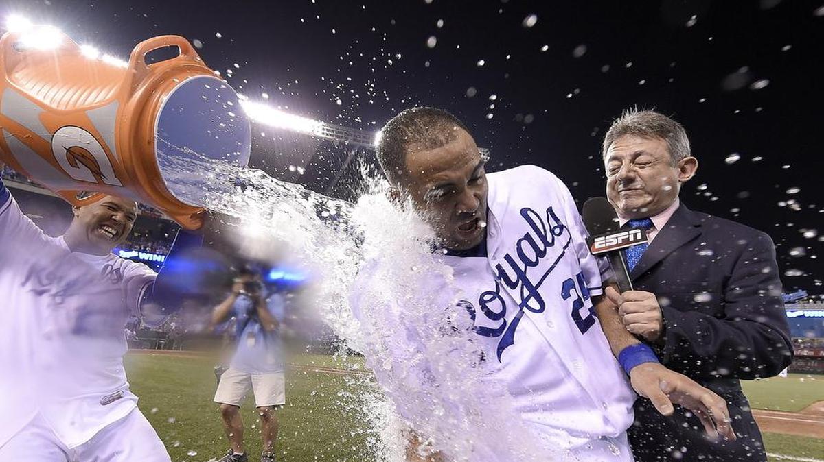 
Kansas City Royals designated hitter Kendrys Morales was doused in celebration after his game-winning hit Sunday in a game televised on ESPN.
