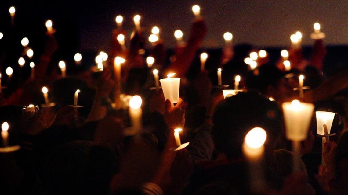 Candles were held aloft in Spring Hill, Kan., during a 2010 vigil for former homecoming king Nathan Stiles, one of the first area football players to perish due to repeated concussive blows to the brain on the field.