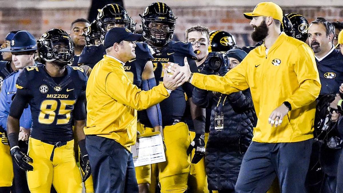 Missouri Tigers football coach Barry Odom celebrated MU’s 26-17 win against the Vanderbilt Commodores with tight ends coach Joe Jon Finley in the final seconds on Saturday, Nov. 12, 2016, in Columbia on Faurot Field in Memorial Stadium. Mizzou defeated the Commodores, 26-17, for the Tigers’ first SEC win of the season.