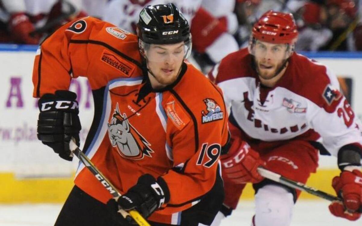 Mavericks forward Ross Johnston (left) was being pursued by the Americans’ Spencer Asuchak as he controled the puck in Saturday night’s game.