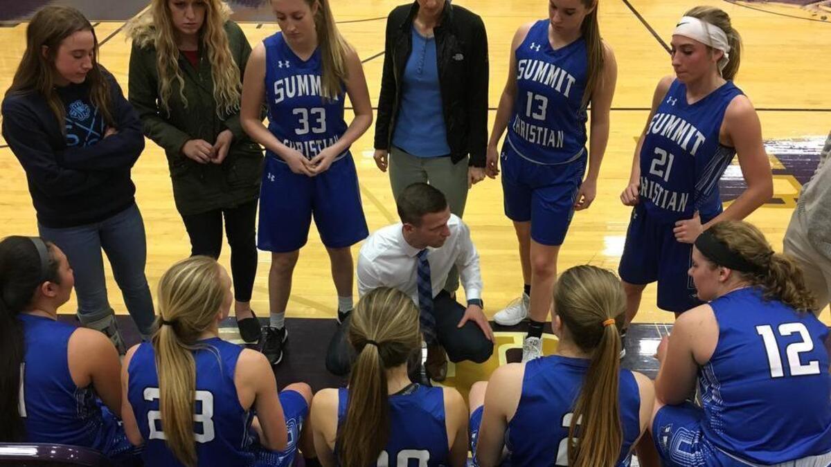 Summit Christian Academy girls’ basketball coach Chad Friess (center) led the Eagles to a school-record 17 victories during his first season. SCA’s season ended Feb. 24 with a 39-23 loss against Barstow in the Class 3, District 14 final at St. Michael the Archangel in Lee’s Summit.