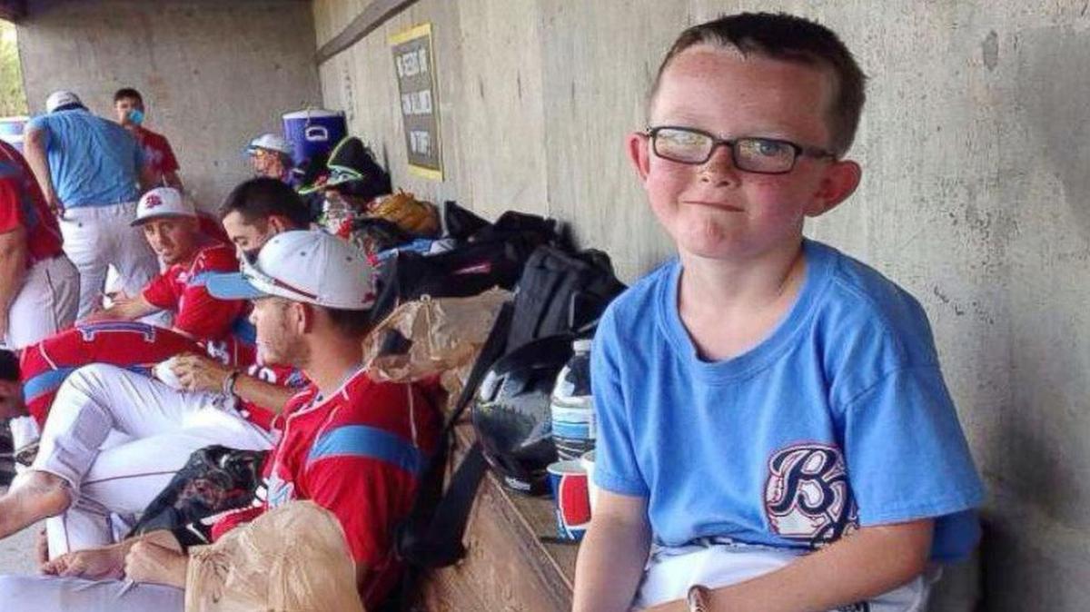 
Nine-year-old bat boy Kaiser Carlile (pictured in the dugout at a Liberal Bee Jays game earlier this season) was accidentally struck by the bat of a Bee Jays on-deck batter during a warm-up swing Saturday at a tournament in Wichita. Kaiser was wearing a helmet at the time. He died Sunday.
