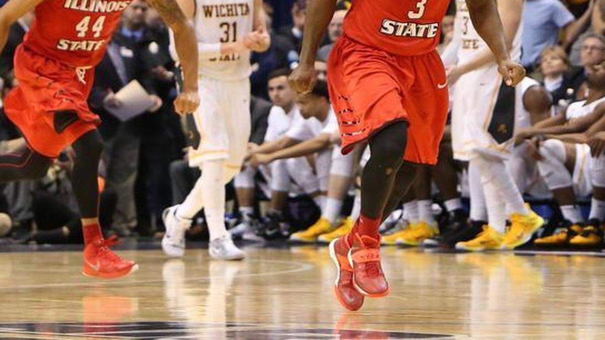 
With the Shockers’ Ron Baker looking on, Illinois State guards Daishon Knight (right) and DeVaugn Akoon-Purcell celebrated after taking out Wichita State in the semifinals of the Missouri Valley Conference Tournament on Saturday in St. Louis.


