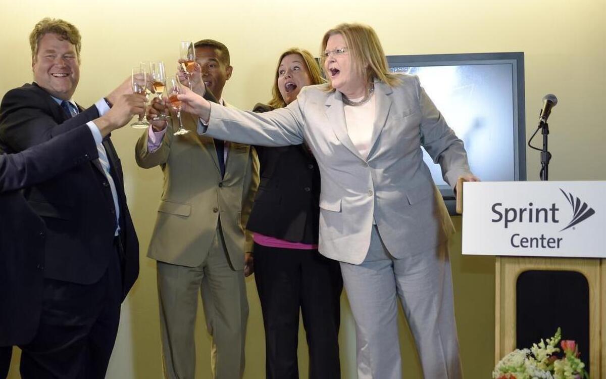 
Brenda Tinnen, right, general manager and senior vice president of Sprint Center, shared a toast with Kathy Nelson, president of Kansas City Sports Commission, Ronnie Burt, president/CEO of Visit KC and city manager Troy Schulte, left, after they heard the announcement that the Big 12 men’s basketball tournament would remain in Kansas City through 2020. 
