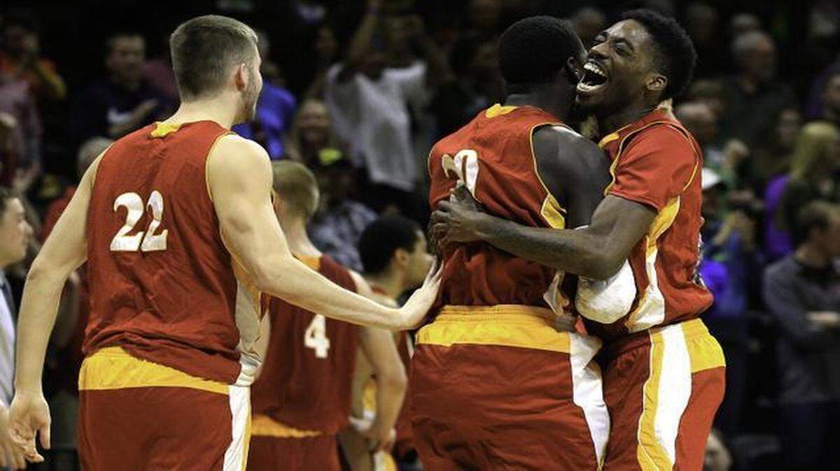 
The fifth-seeded Pittsburg State Gorillas celebrated their 65-58 win over top-seeded Northwest Missouri.



