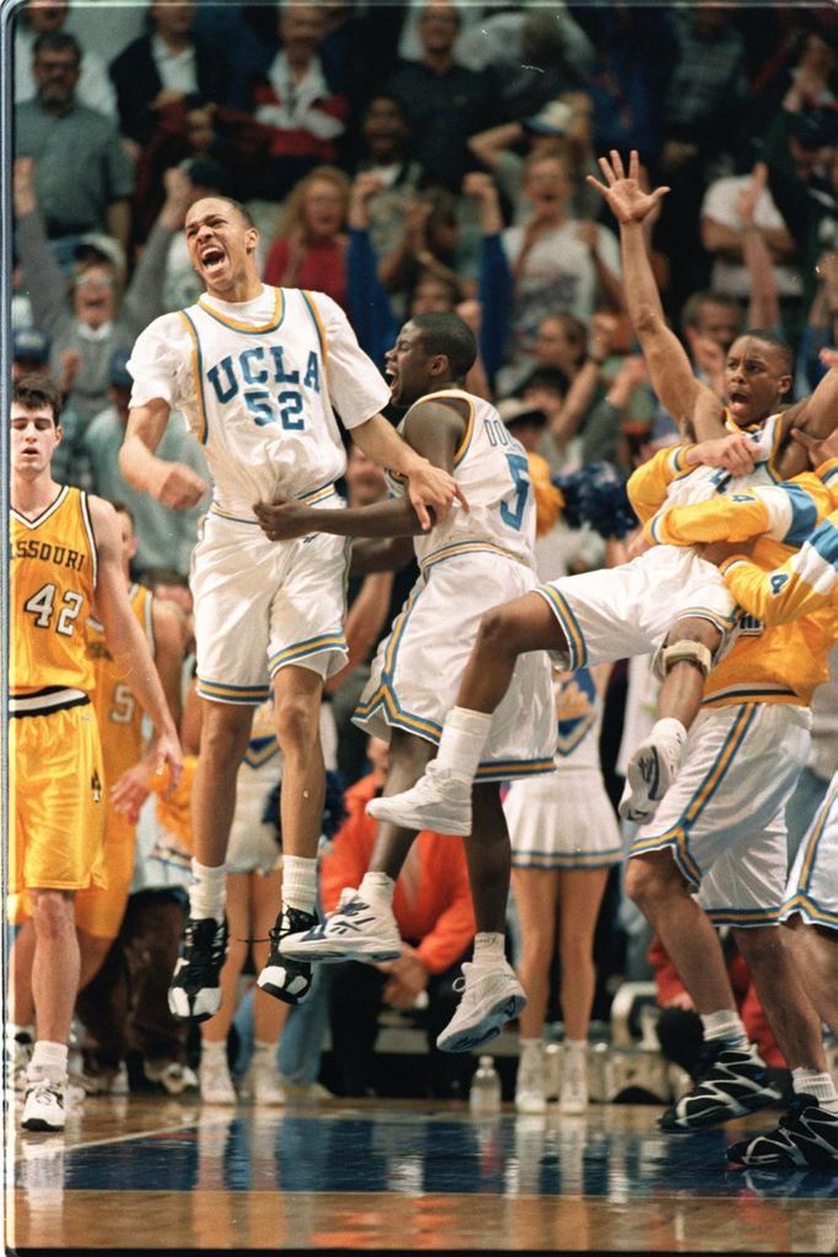 The ecstatic UCLA bench hoisted Tyus Edney, right, in celebration after his game-winning shot on March 20, 1995, in Boise.