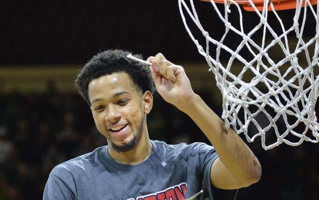 Northwest Missouri State’s Justin Pitts helped cut down the net after the Bearcats’ 69-61 win over Central Missouri in the MIAA Tournament title game Sunday at Municipal Auditorium. Pitts, who went to Blue Springs South, scored 26 points in the championship game.