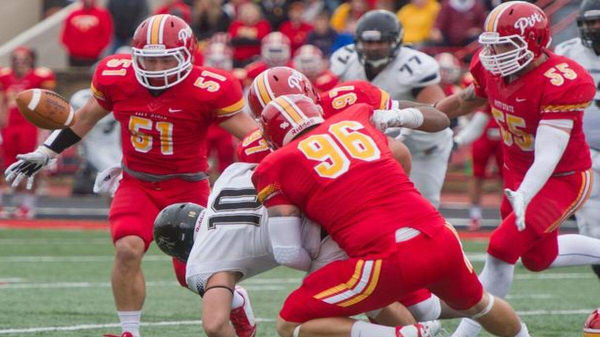 A hit by Pittsburg State’s Dallas Shalz forced Harding’s Keenan Kellett to fumble, and Colby Hall (left) recovered the ball for the Gorillas in Saturday’s playoff game. <252><137>The Gorillas Dallas Shalz forces Harding's Keenan Kellett to fumble. Colby Hall recovered the ball for the Gorillas. <252><137>