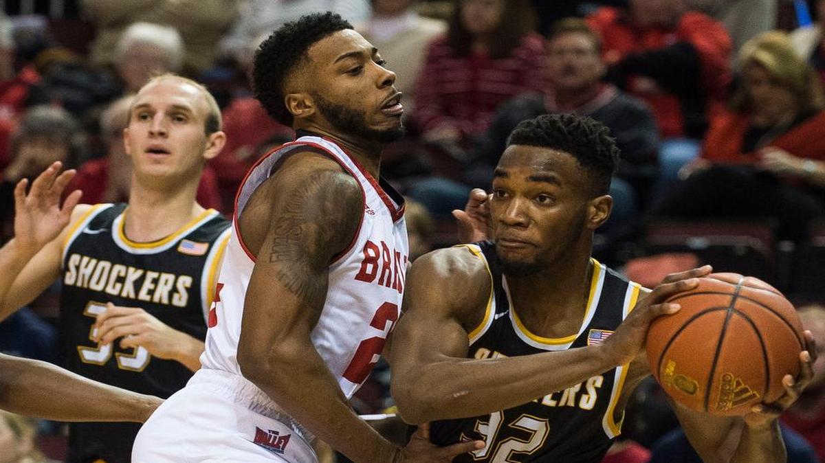 Wichita State forward Markis McDuffle (32) looked to make a pass around Bradley junior JoJo McGlaston on Sunday.