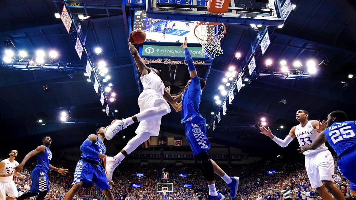 KU’s Wayne Selden (left) scored 33 points, including this dunk over Kentucky’s Skal Labissiere, during the Jayhawks’ 90-84 overtime win over the Wildcats last season at Allen Fieldhouse.