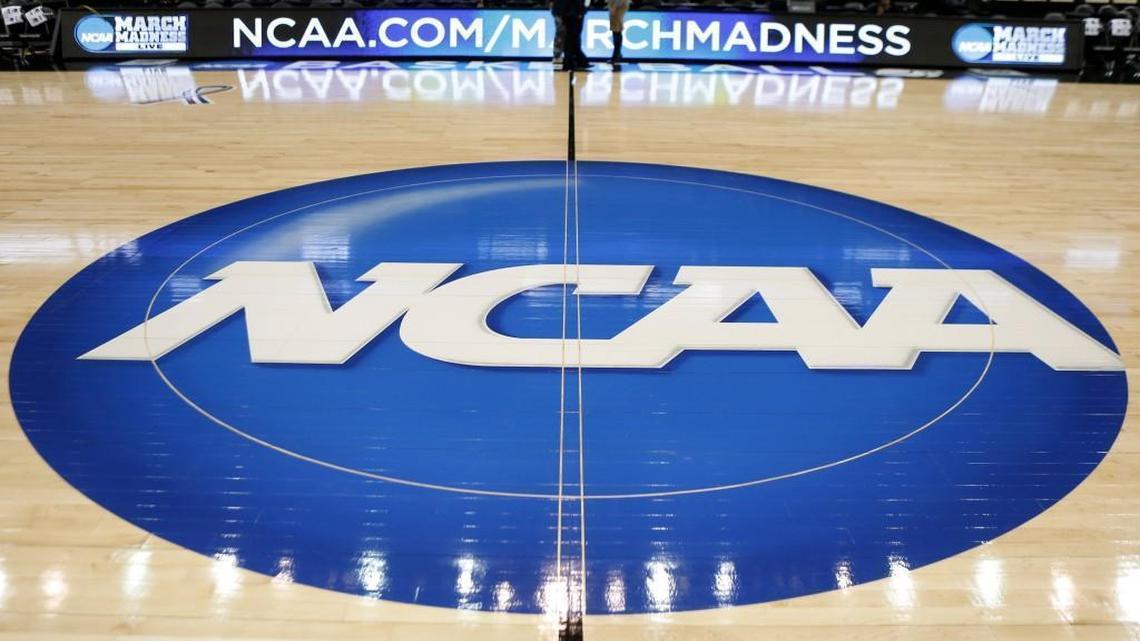 In this March 18, 2015, file photo, the NCAA logo is at center court as work continues at The Consol Energy Center in Pittsburgh.