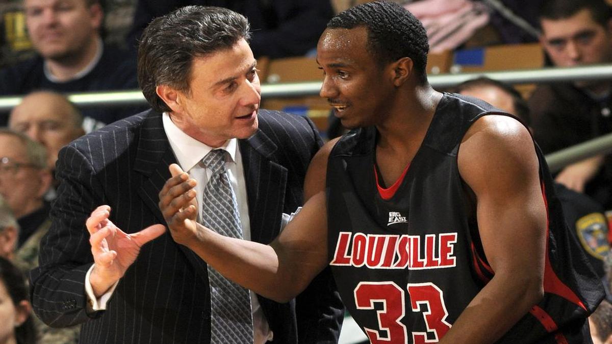 Louisville men’s basketball coach Rick Pitino (left), with Andre McGee, a former player who became Louisville’s director of basketball operations.