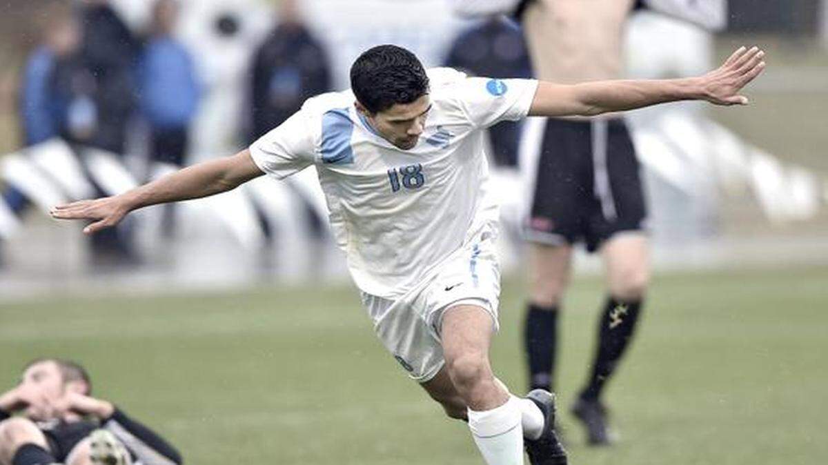 
Tufts University’s Gus Santos (18) celebrates the first of his two second half goals against Ohio Wesleyan University during Friday’s NCAA Division III men’s soccer semifinals at Swope Soccer Village in Kansas City, Mo. Tufts won, 3-0, to advance to Saturday’s final against Wheaton College.
