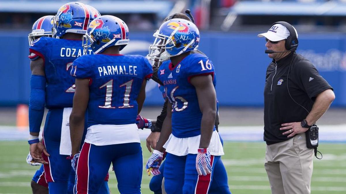 
Kansas coach David Beaty (right) watches data about his team but — like every other college coach — isn’t going to try to convert every fourth down, despite studies that say it works.
