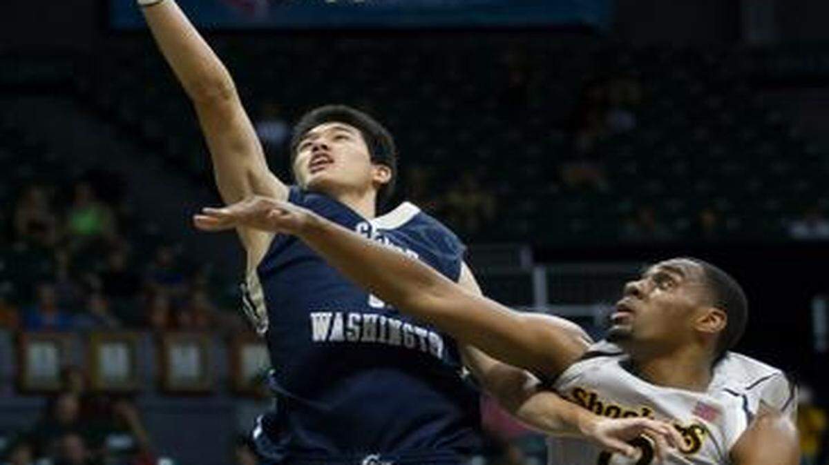 
George Washington’s Yuta Watanabe took a shot as Wichita State’s Darius Carter defended.


