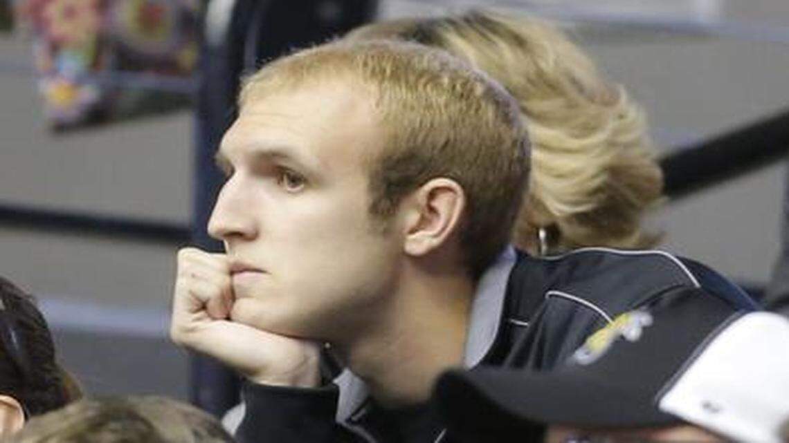 
Connor Frankamp, who recently left the KU basketball team, watches Wichita State's opening exhibition game with his father Marty. He told WSU coaches on Monday he would enroll at the school.
